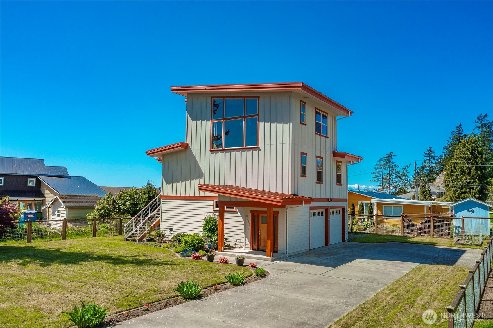 8285 Sunset Street Blaine, WA 98230 - Photo 3 of 38 a front view of a house with a yard