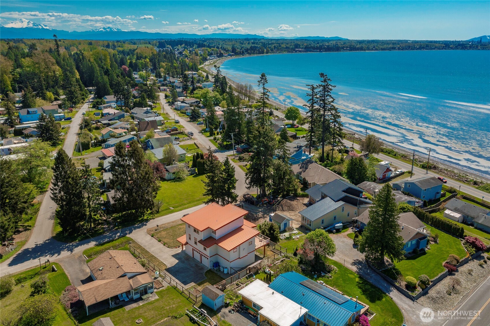 8285 Sunset Street Blaine, WA 98230 - Photo 6 of 38 an aerial view of a house with a lake view