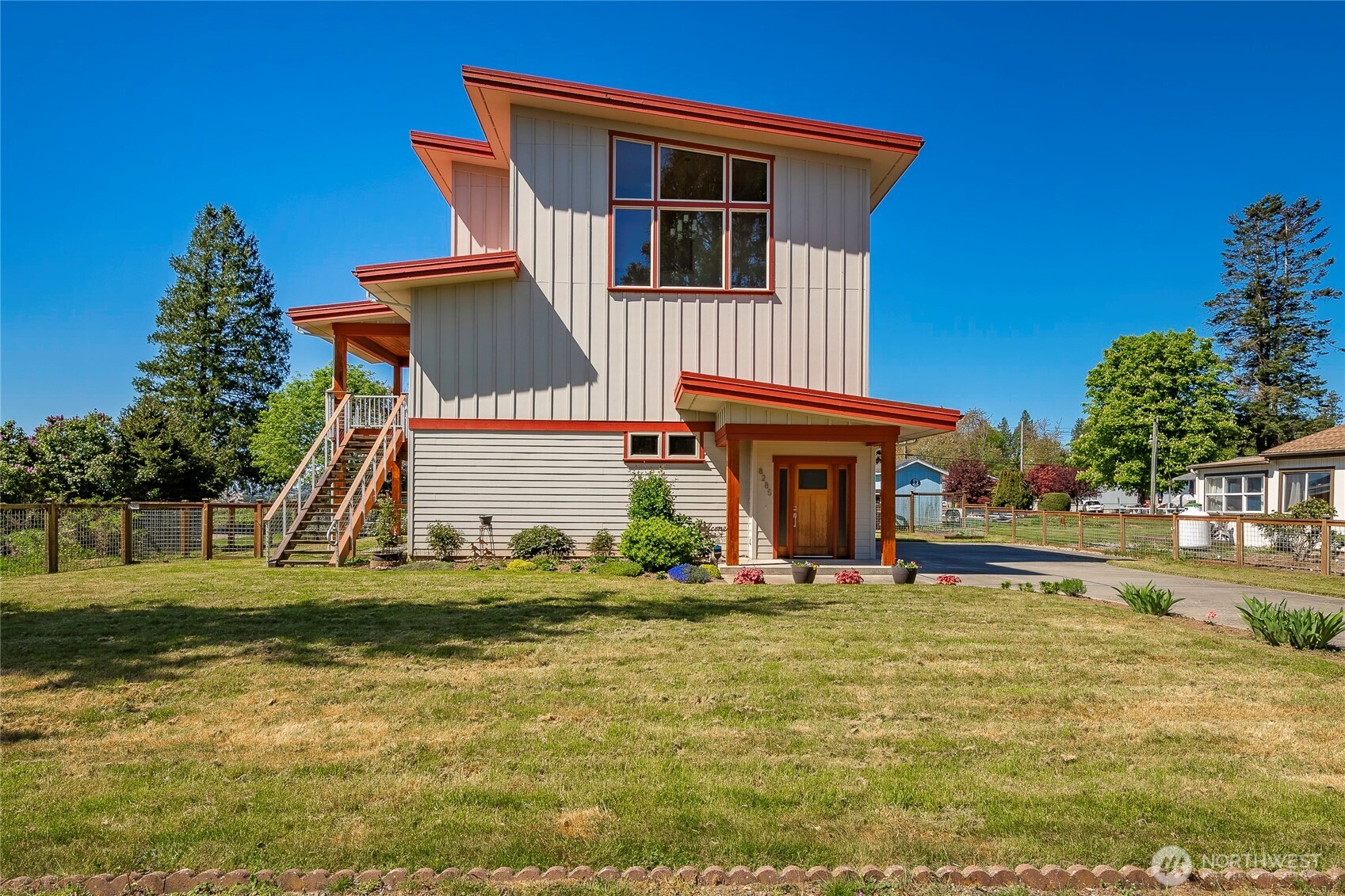 8285 Sunset Street Blaine, WA 98230 - Photo 9 of 38 a view of a house with pool and a yard