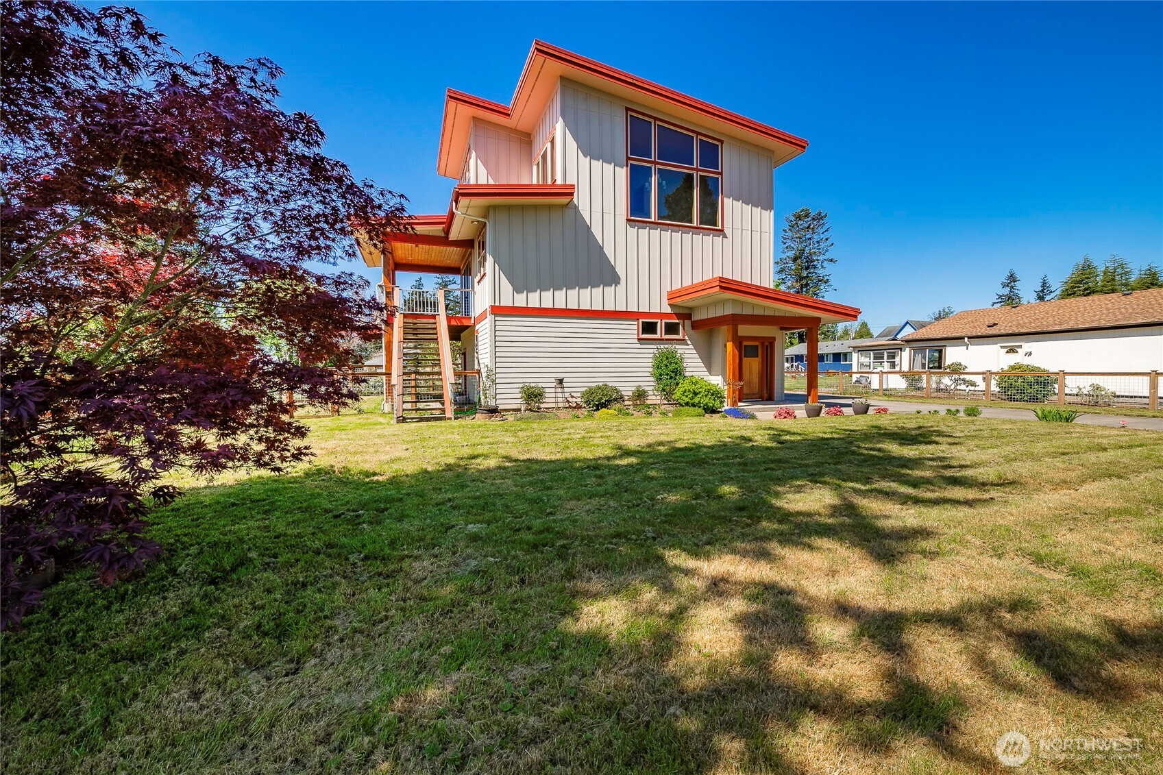 8285 Sunset Street Blaine, WA 98230 - Photo 10 of 38 a front view of a house with garden