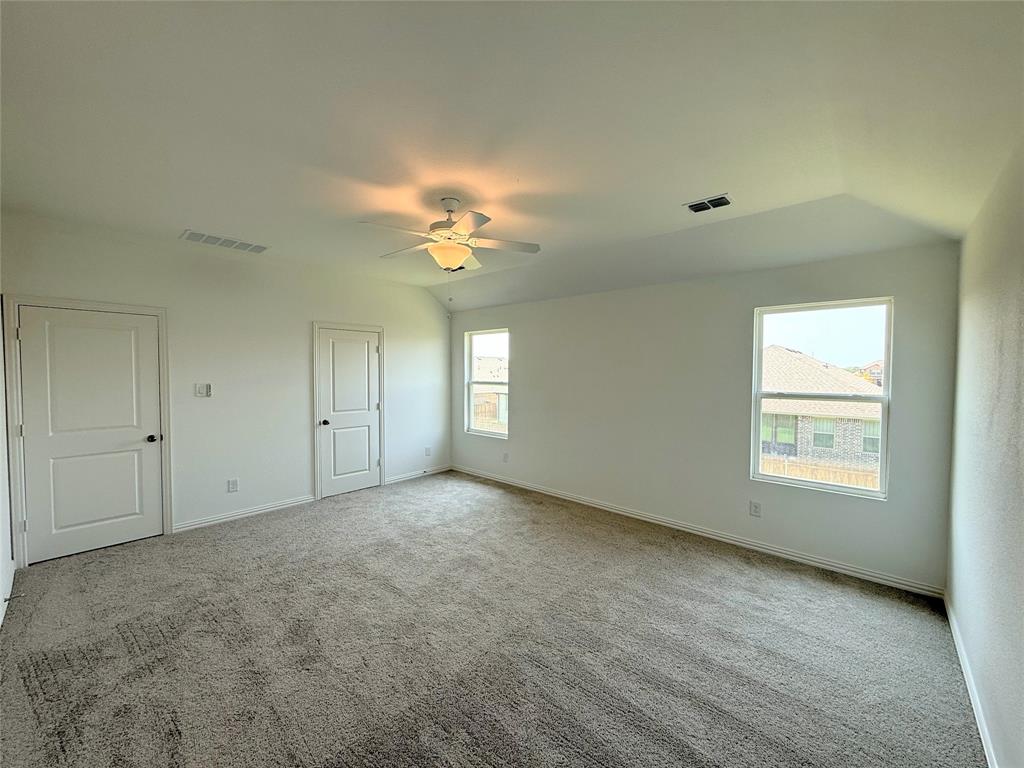 713 Roanoke Drive Princeton, TX 75407 - Photo 13 of 40 Unfurnished bedroom with light carpet and a ceiling fan
