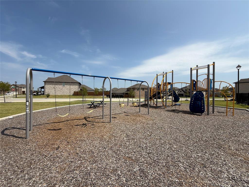 713 Roanoke Drive Princeton, TX 75407 - Photo 36 of 40 Communal playground with a residential view