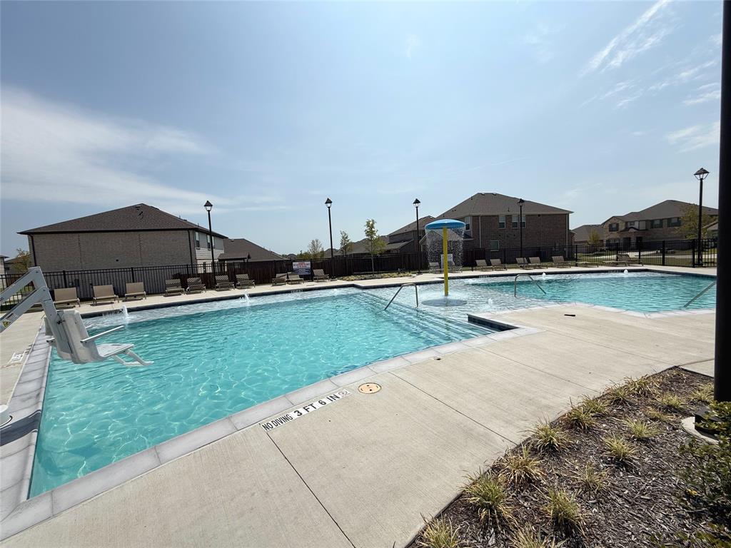 713 Roanoke Drive Princeton, TX 75407 - Photo 38 of 40 Community pool featuring a patio area and a residential view