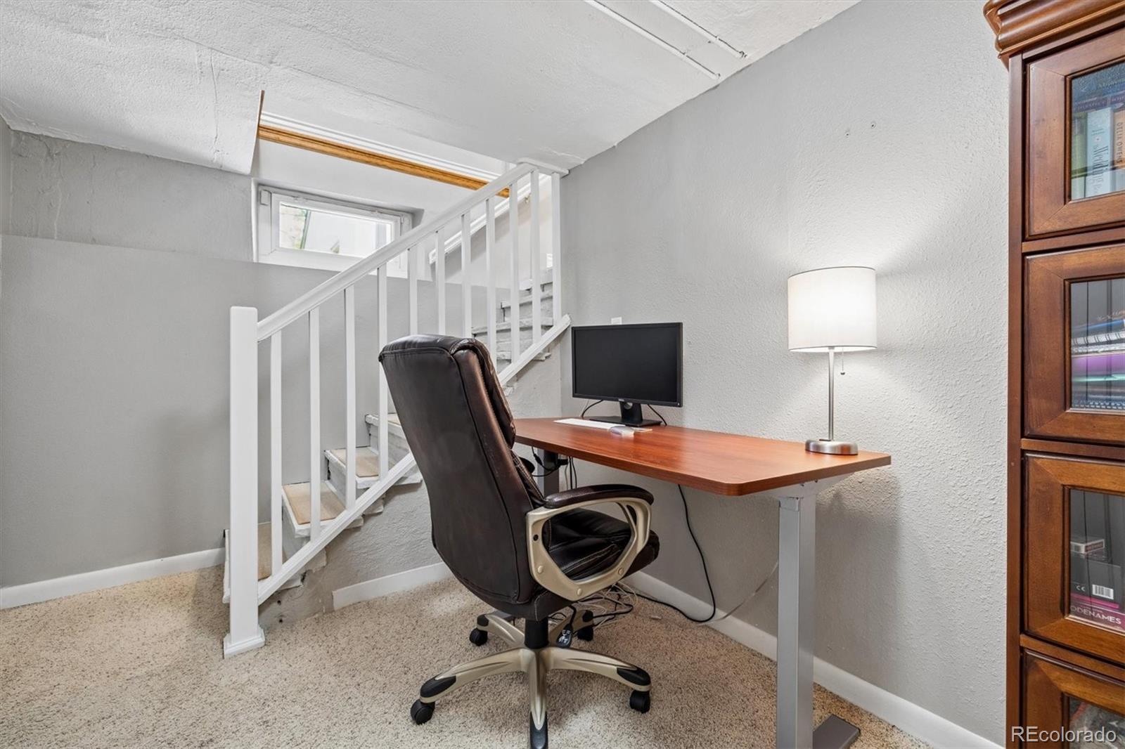 730 Ivanhoe Street Denver, CO 80220 - Photo 24 of 34 a view of a workspace with furniture and a window