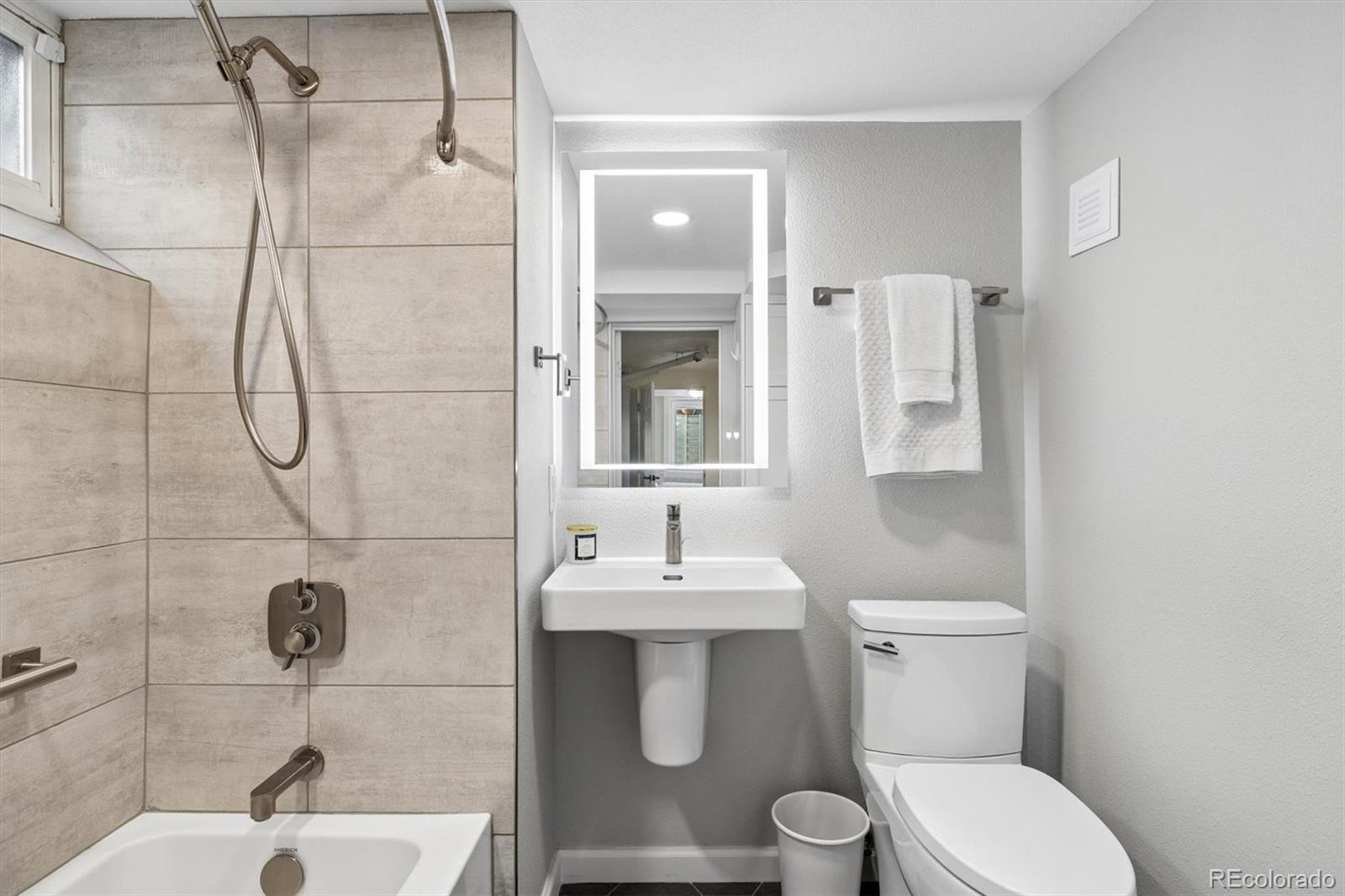 730 Ivanhoe Street Denver, CO 80220 - Photo 29 of 34 a bathroom with a sink toilet and shower