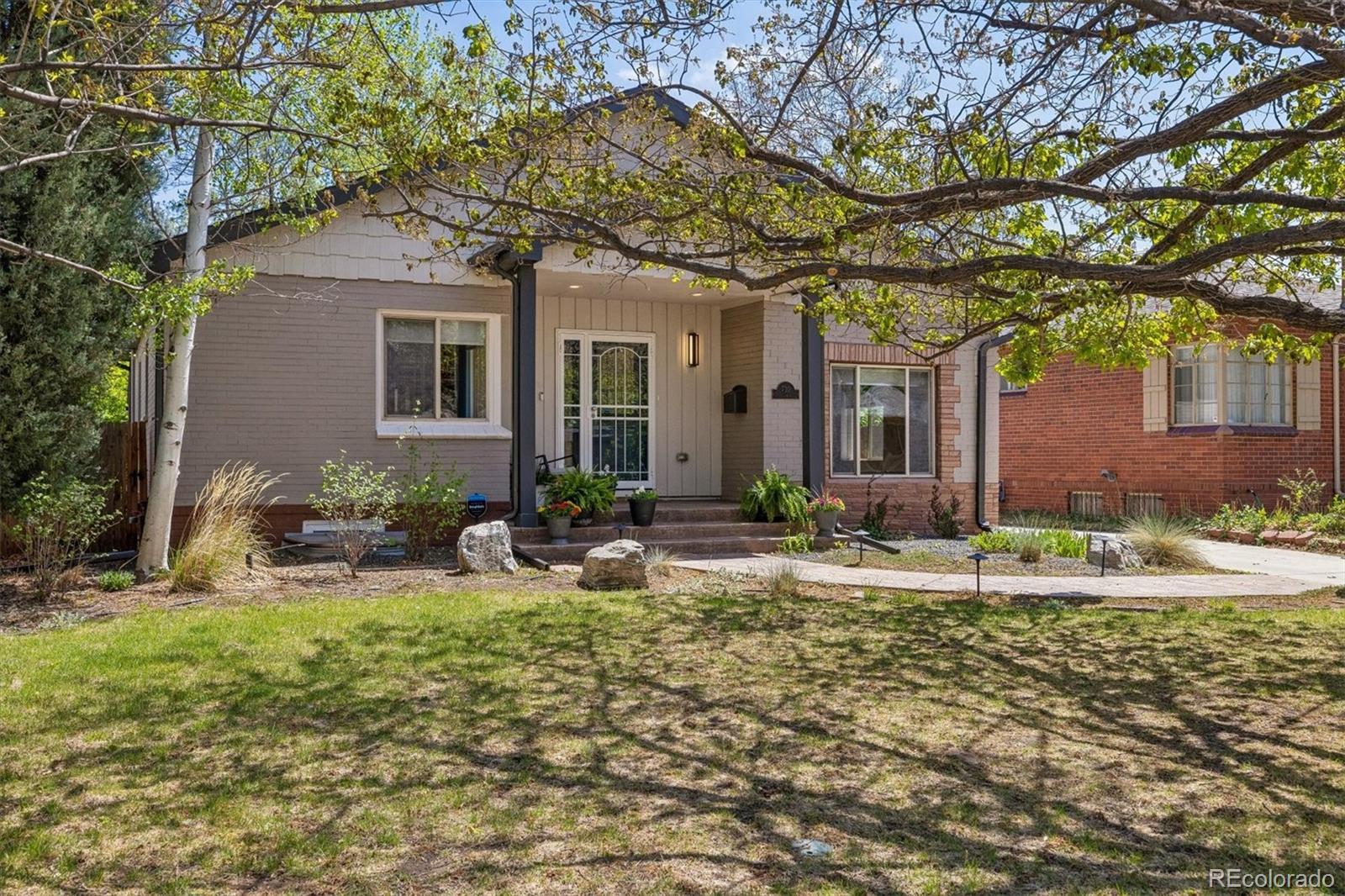 730 Ivanhoe Street Denver, CO 80220 - Photo 3 of 34 a backyard of a house with yard and outdoor seating