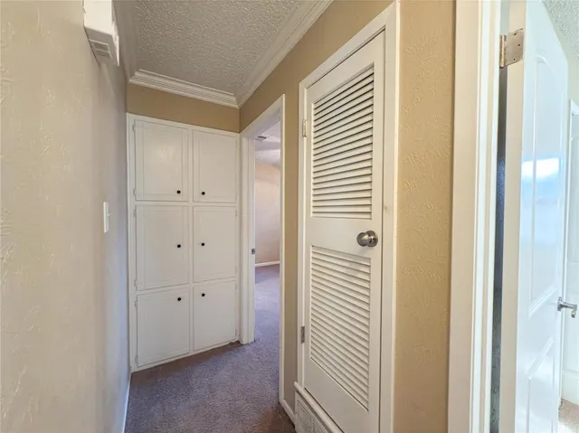 a view of a bathroom from a hallway