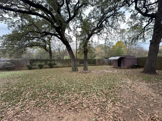 a backyard of a house with lots of green space