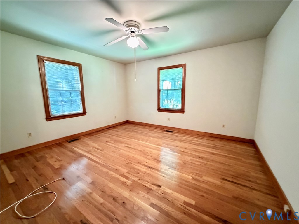 3933 Dunraven Road North Chesterfield, VA 23236 - Photo 28 of 30 a view of an empty room with a window and wooden floor