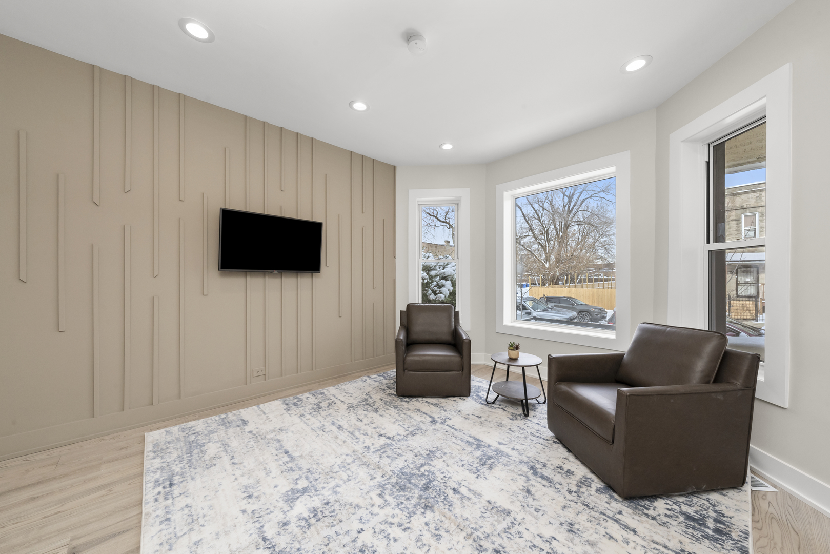 3107 West Flournoy Street Chicago, IL 60612 - Photo 16 of 39 a living room with furniture and a flat screen tv