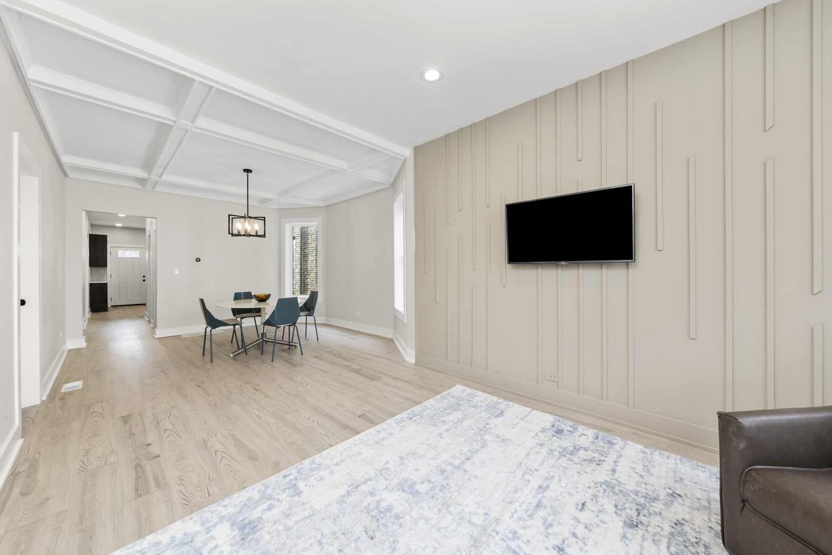 3107 West Flournoy Street Chicago, IL 60612 - Photo 18 of 39 a living room with furniture and a flat screen tv