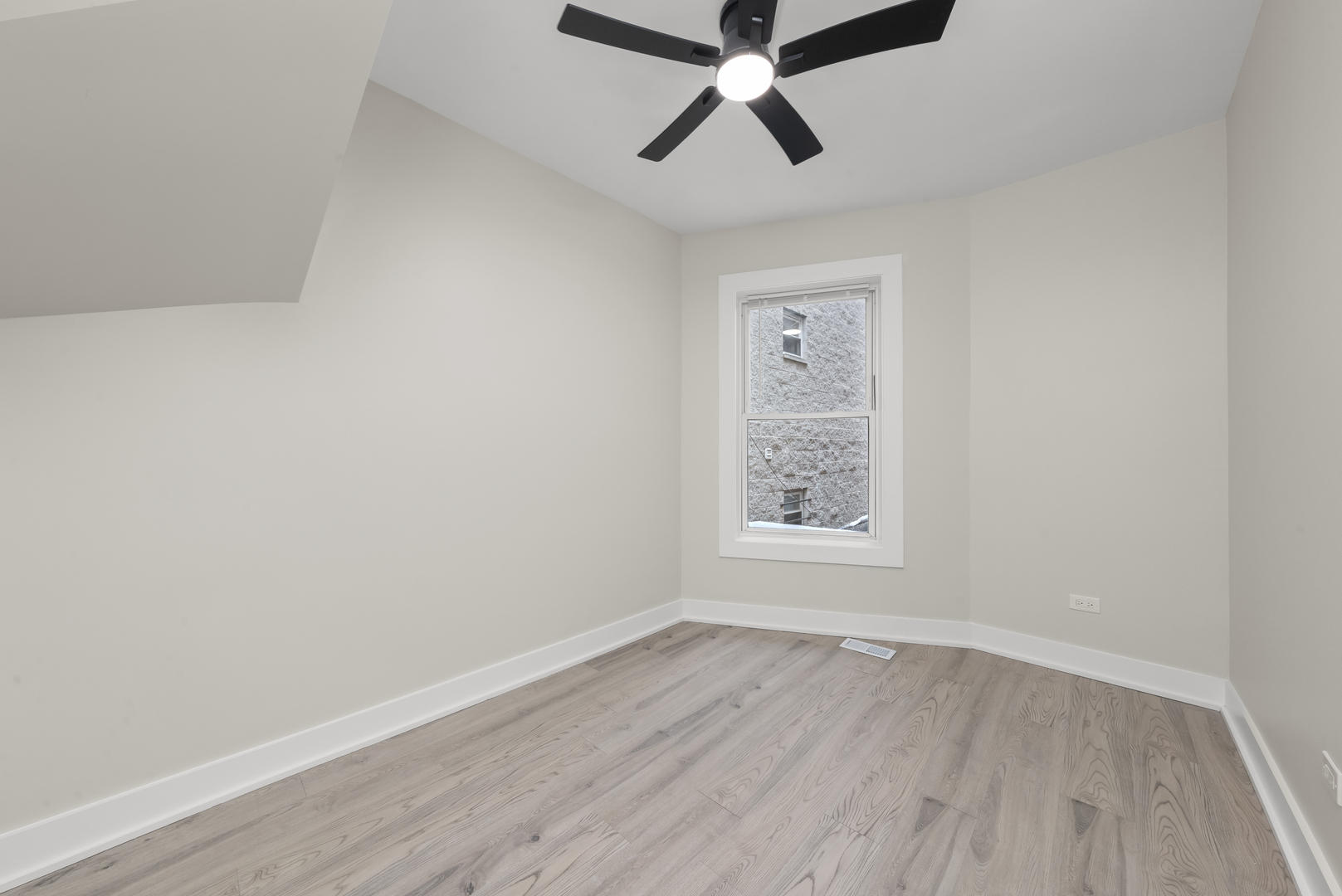 3107 West Flournoy Street Chicago, IL 60612 - Photo 21 of 39 an empty room with wooden floor and windows