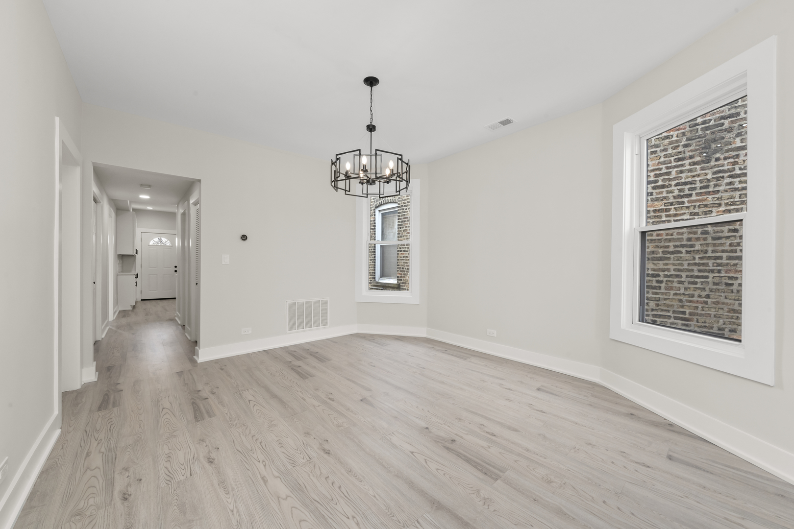 3107 West Flournoy Street Chicago, IL 60612 - Photo 6 of 39 a view of livingroom with hardwood floor and hallway