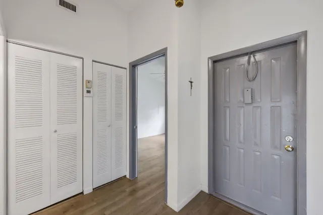 a kitchen with stainless steel appliances granite countertop a refrigerator a sink and a stove