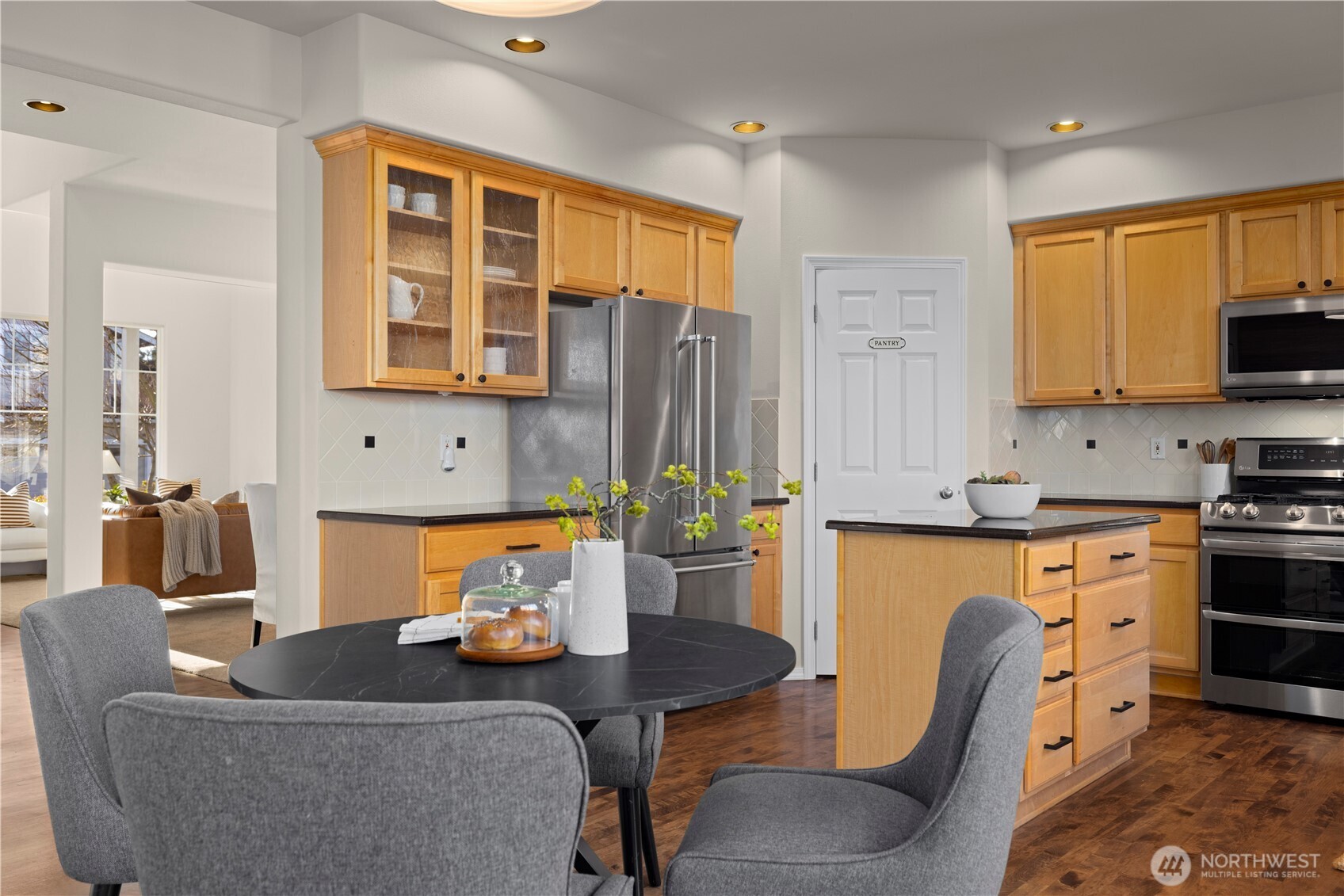 105 202nd Street Southeast Bothell, WA 98012 - Photo 11 of 40 a living room with furniture a flat screen tv and kitchen view