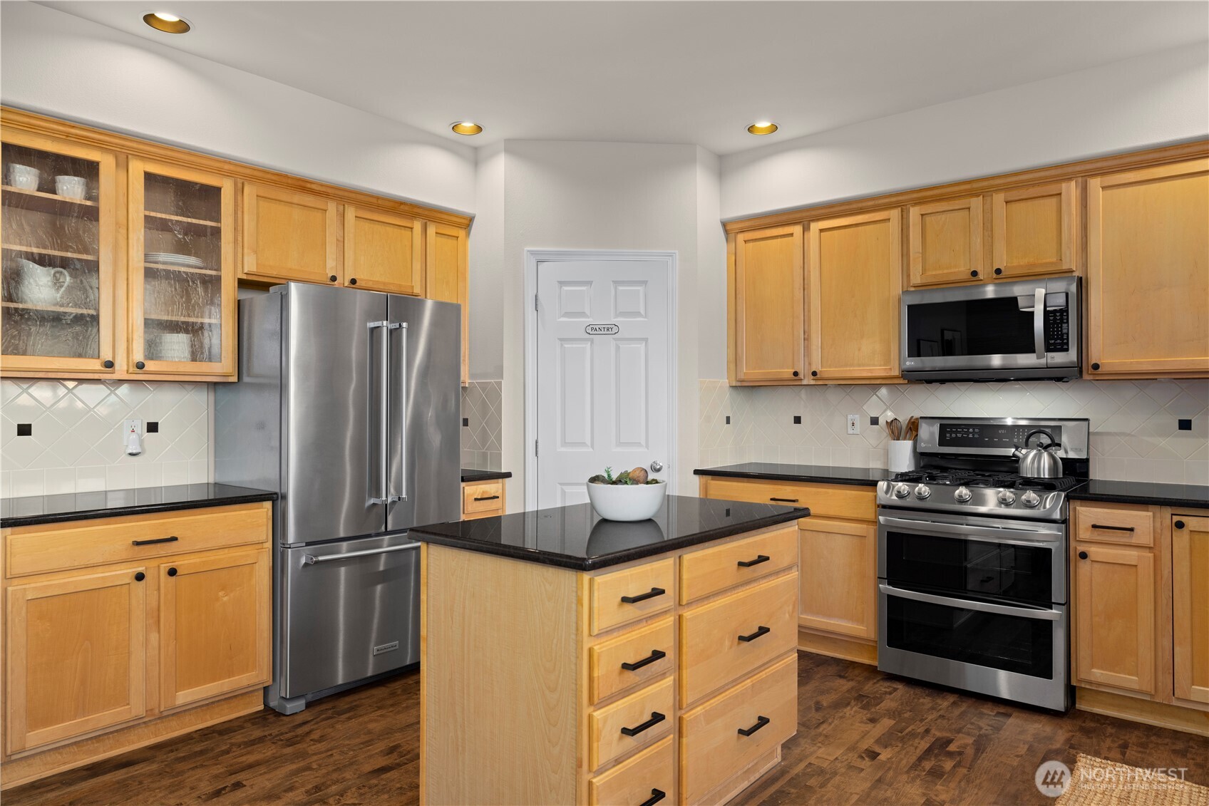 105 202nd Street Southeast Bothell, WA 98012 - Photo 15 of 40 a kitchen with stainless steel appliances a refrigerator stove and sink