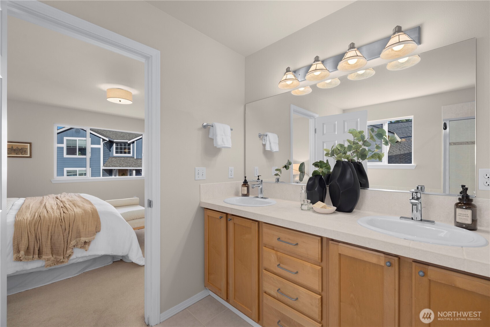 105 202nd Street Southeast Bothell, WA 98012 - Photo 24 of 40 a bathroom with a double vanity sink and a mirror