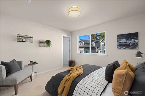 a bedroom with bed and a window