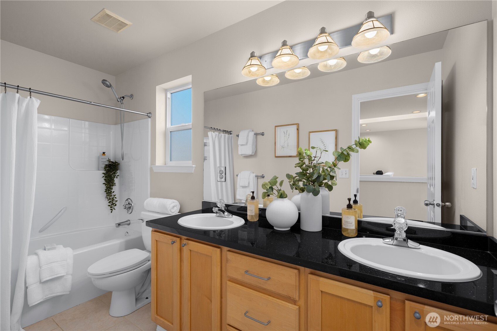 105 202nd Street Southeast Bothell, WA 98012 - Photo 30 of 40 a bathroom with a granite countertop sink mirror and toilet