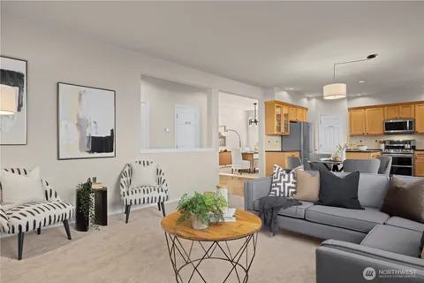 a living room with furniture kitchen and a dining table