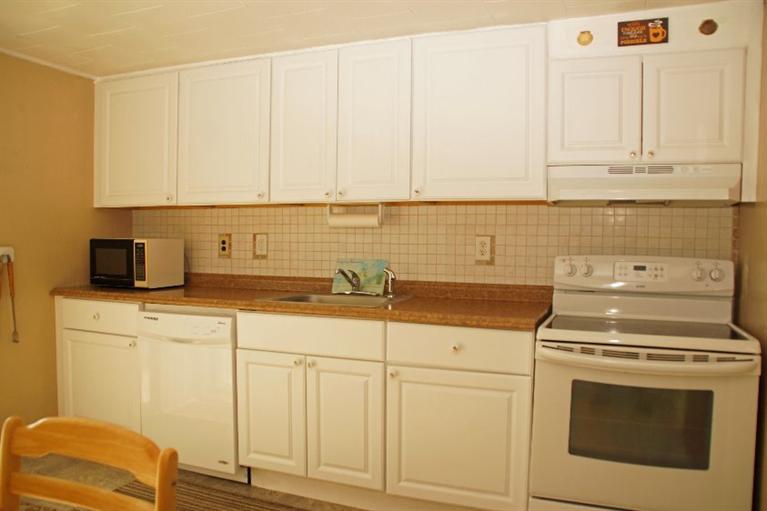 21 Gilbert Road Dennis Port, MA 02639 - Photo 12 of 18 a kitchen with white cabinets and white appliances