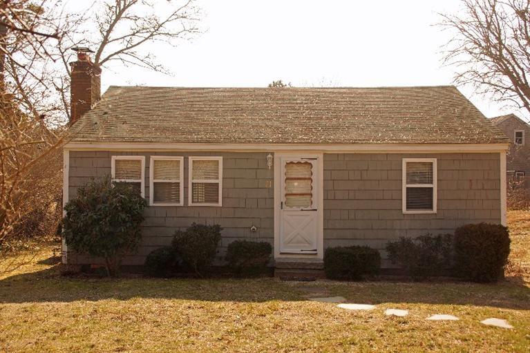 21 Gilbert Road Dennis Port, MA 02639 - Photo 2 of 18 a view of a house with a yard