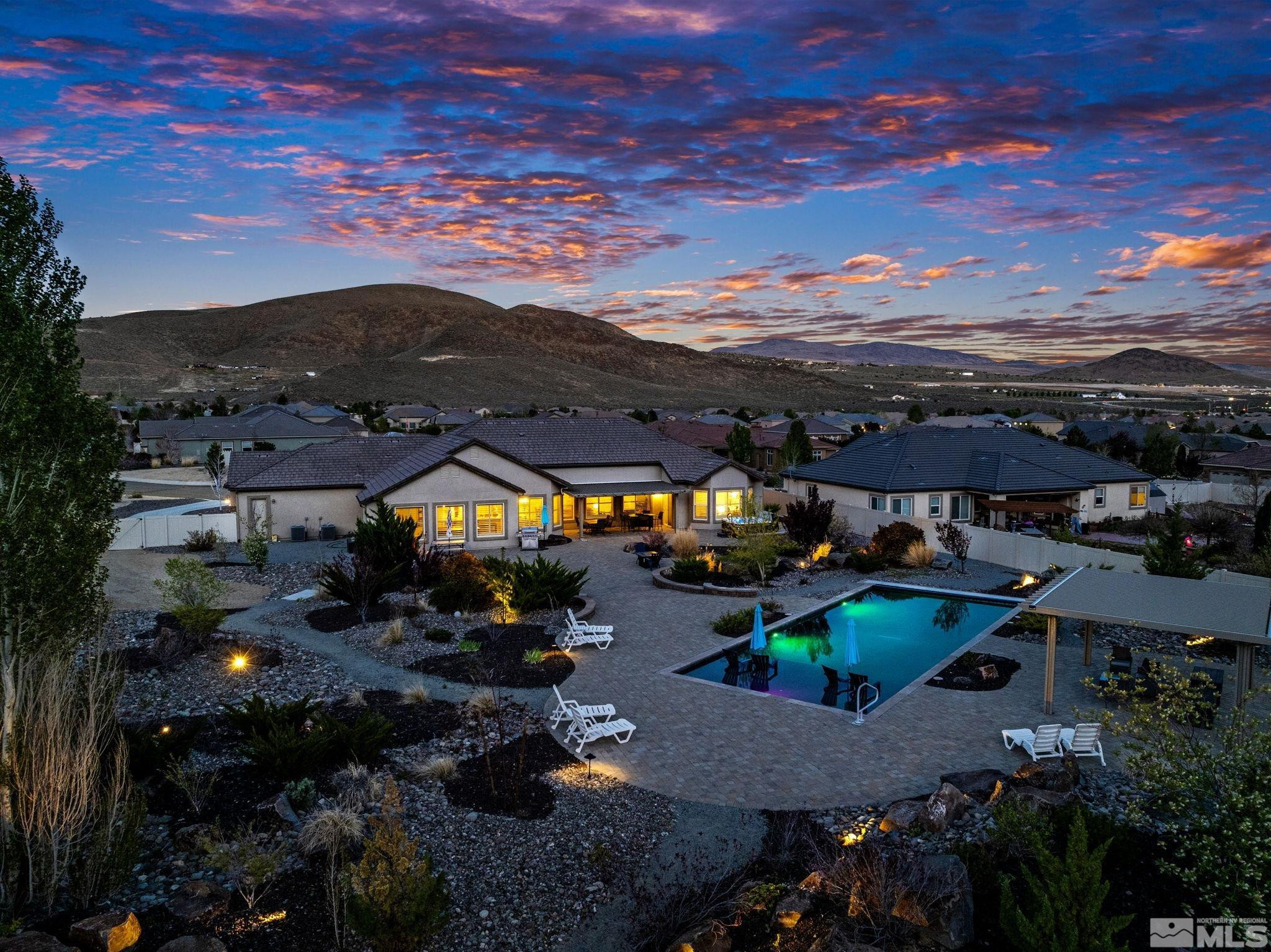 a view of a houses with a swimming pool
