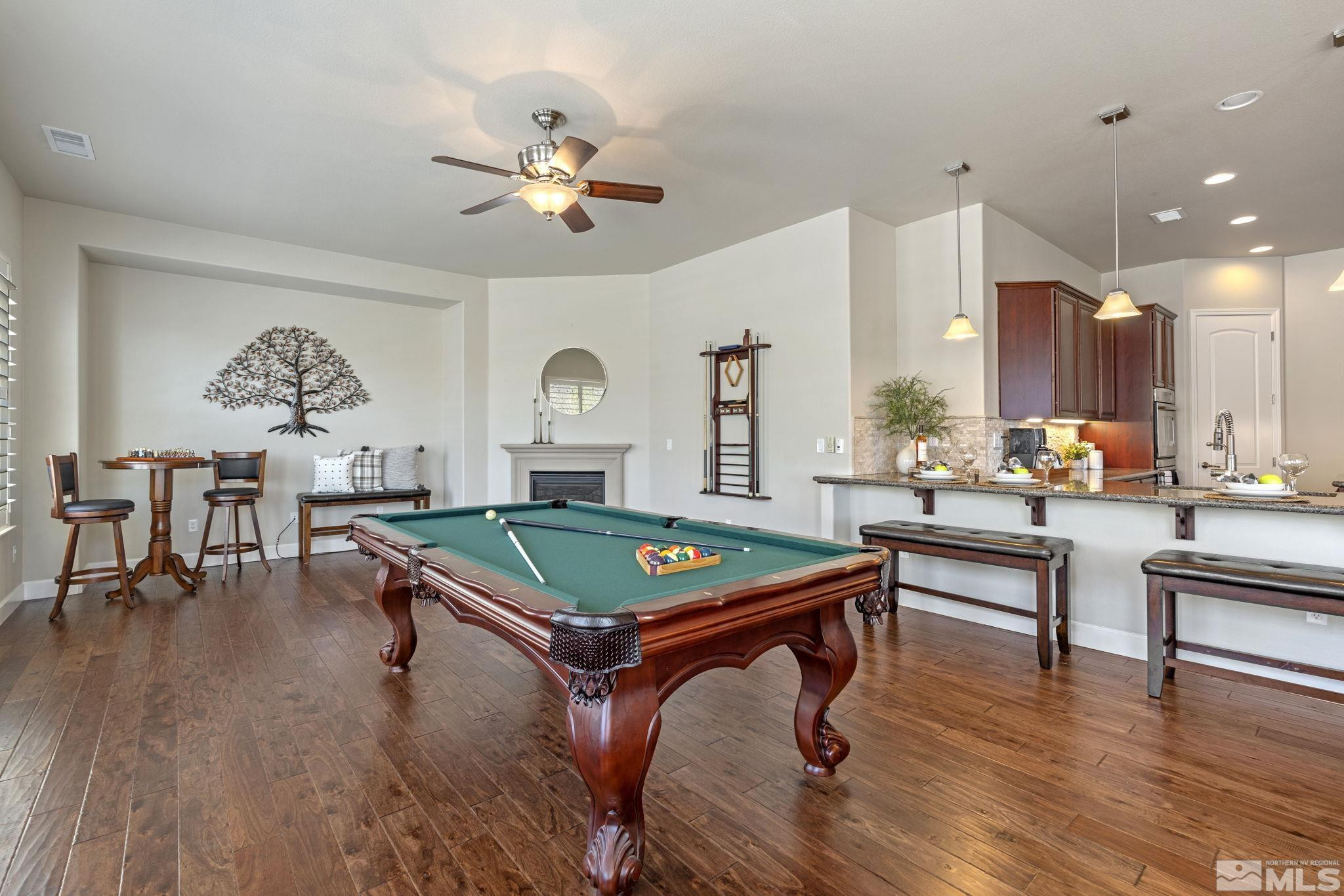 12265 Hidden Sparks, NV 89441 - Photo 19 of 39 a living room with furniture a pool table and a large window
