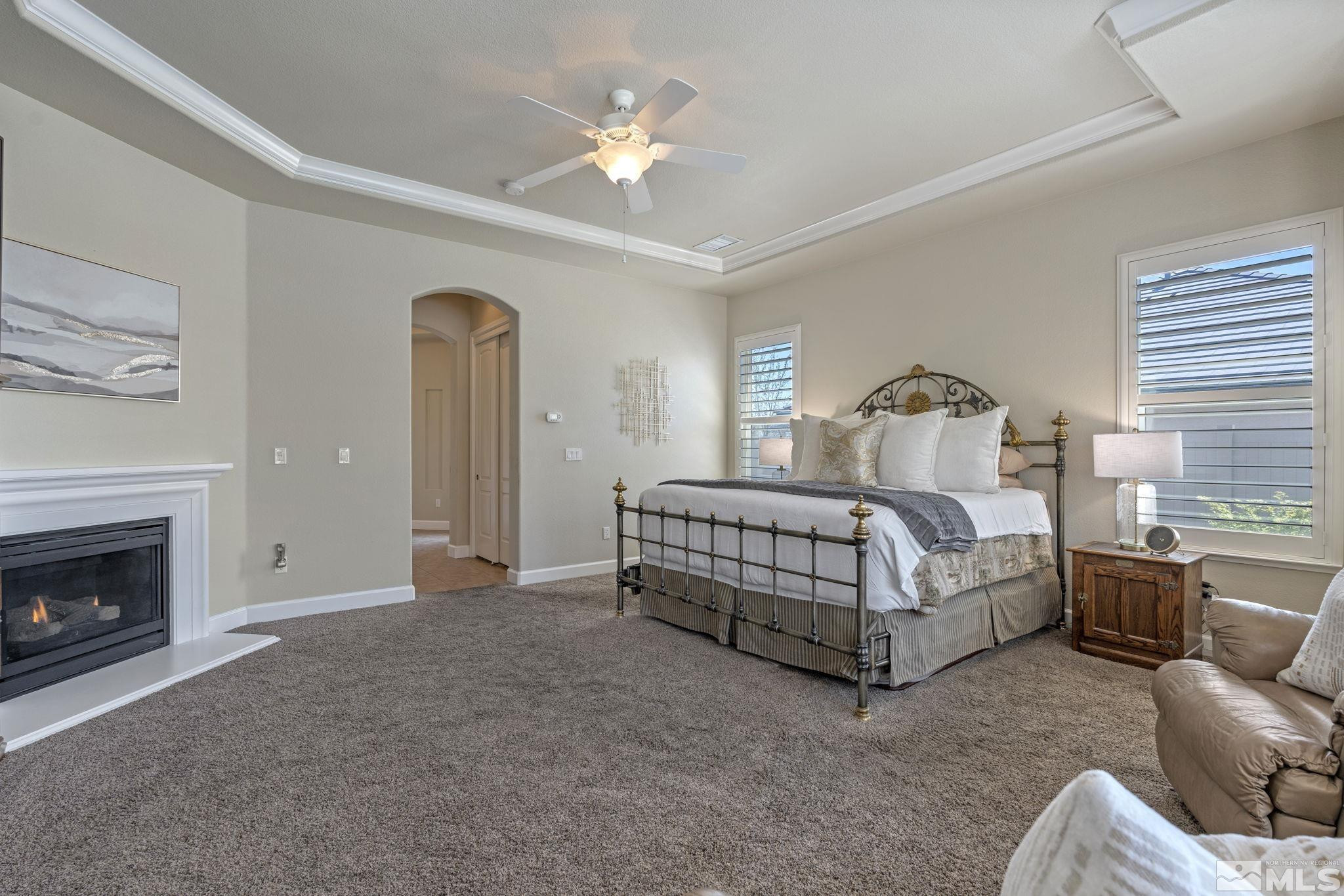 12265 Hidden Sparks, NV 89441 - Photo 22 of 39 a bedroom with a bed and a fireplace