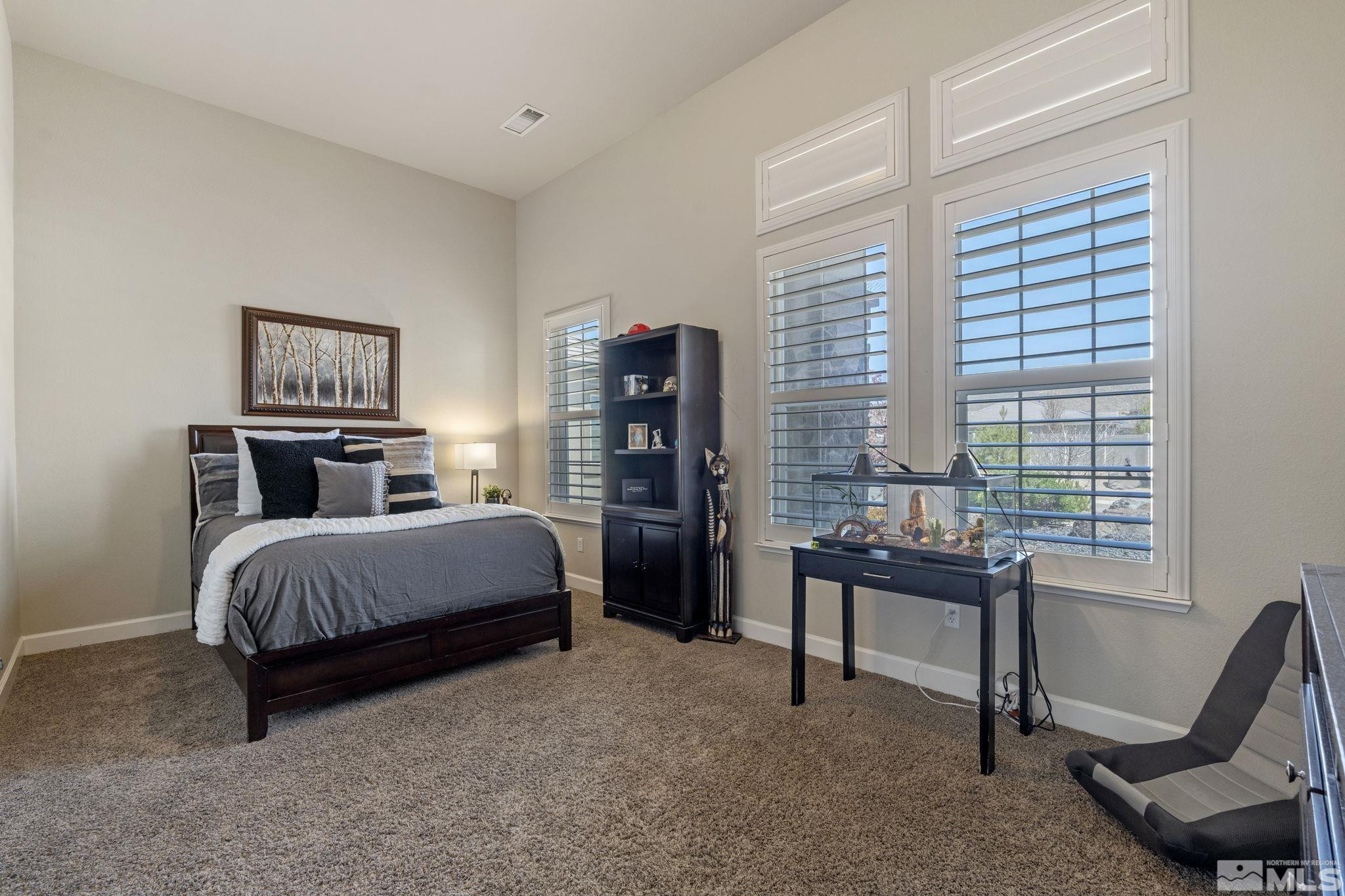 12265 Hidden Sparks, NV 89441 - Photo 25 of 39 a bedroom with a bed and a desk