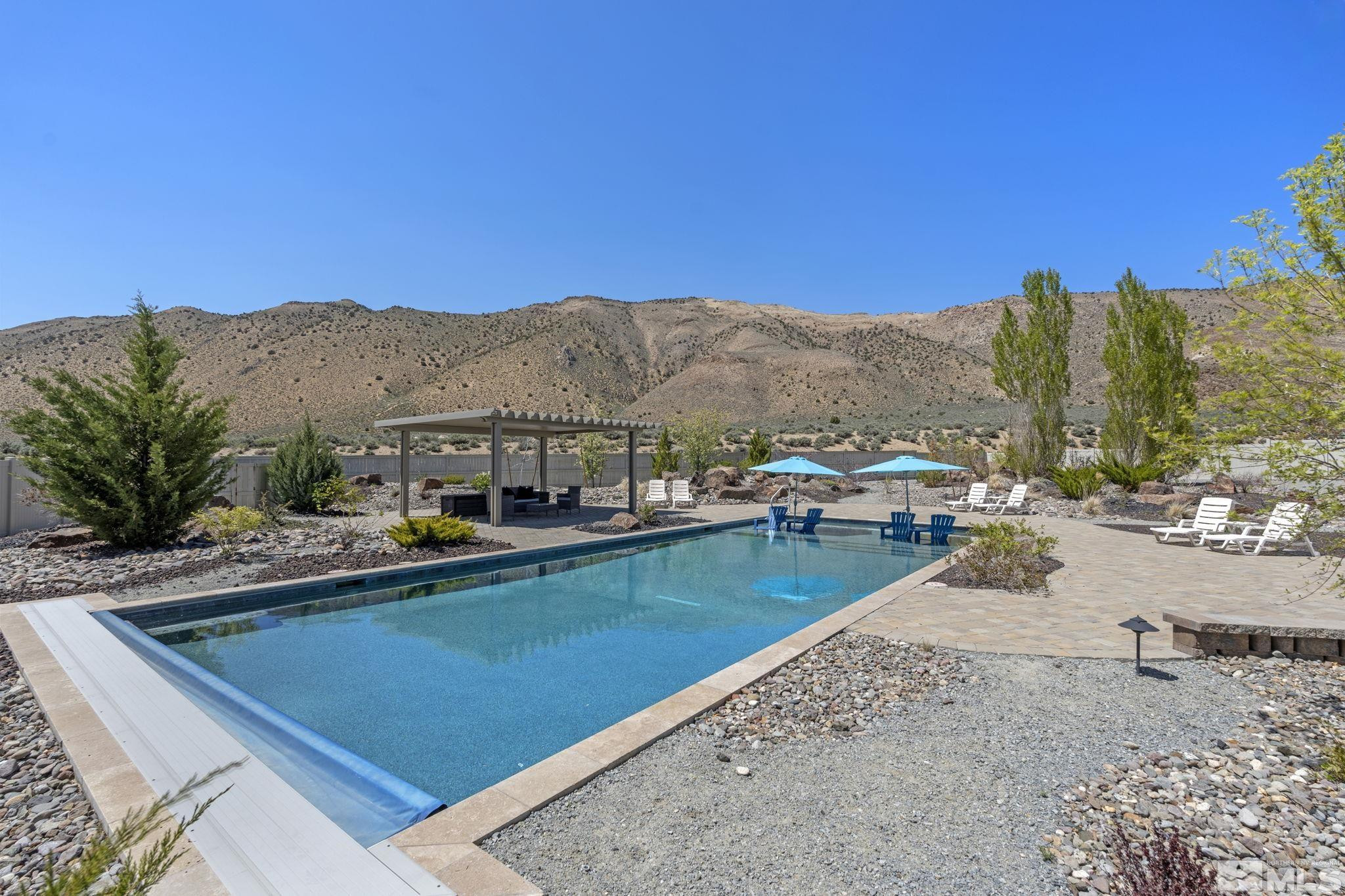 12265 Hidden Sparks, NV 89441 - Photo 32 of 39 a view of a swimming pool with lounge chair