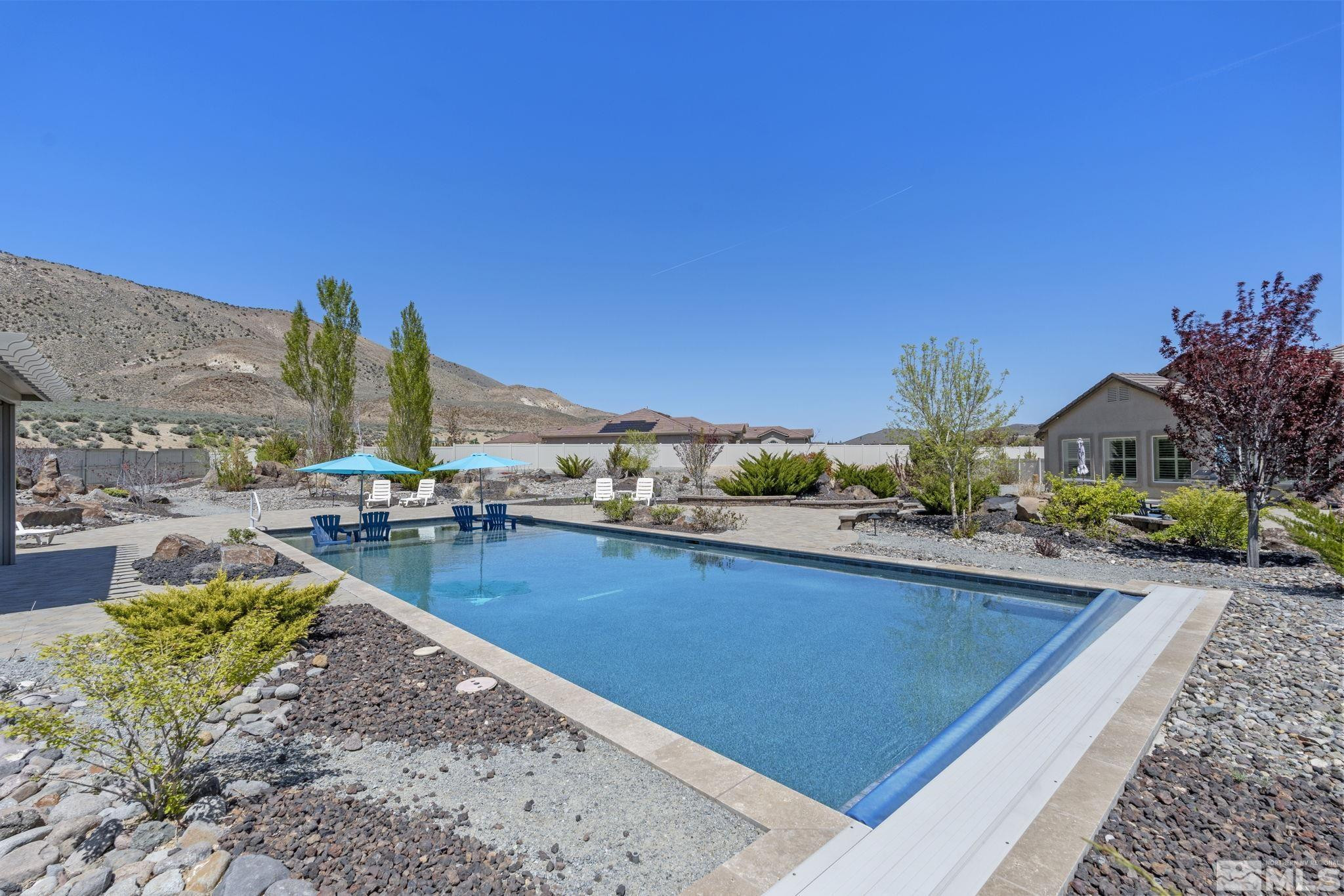 12265 Hidden Sparks, NV 89441 - Photo 33 of 39 a view of a backyard patio and swimming pool