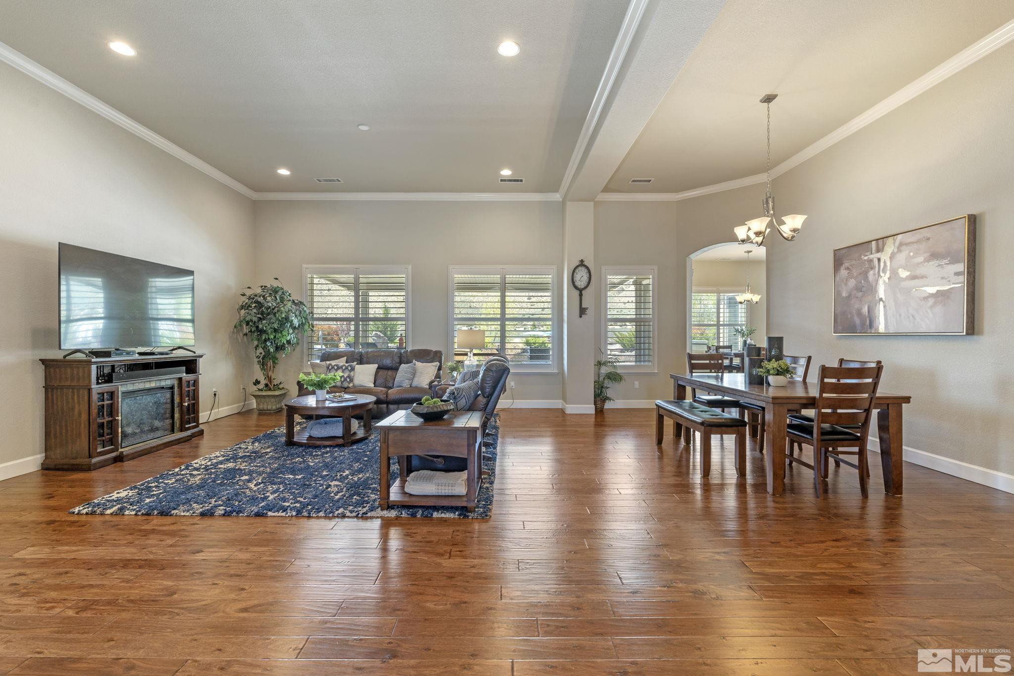 12265 Hidden Sparks, NV 89441 - Photo 9 of 39 a view of a dining room with furniture window and wooden floor