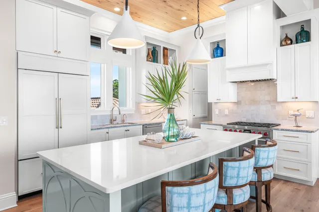 a view of a hallway with wooden floor and entryway