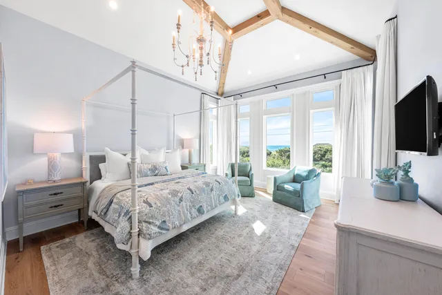 a view of a backyard with table and chairs with wooden fence