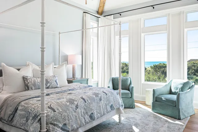 a view of a patio with a table chairs and backyard