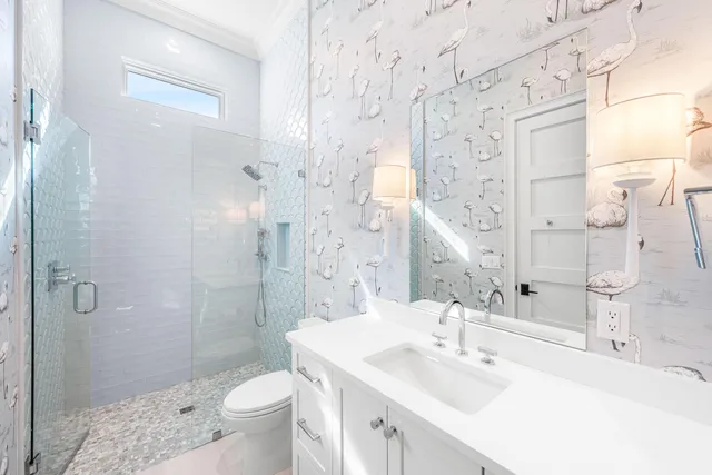 an aerial view of a house with a ocean view