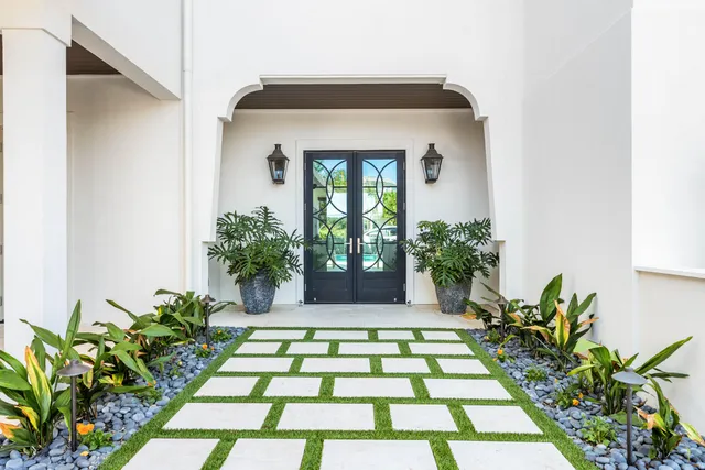 a spacious bathroom with a granite countertop sink mirror and a bathtub