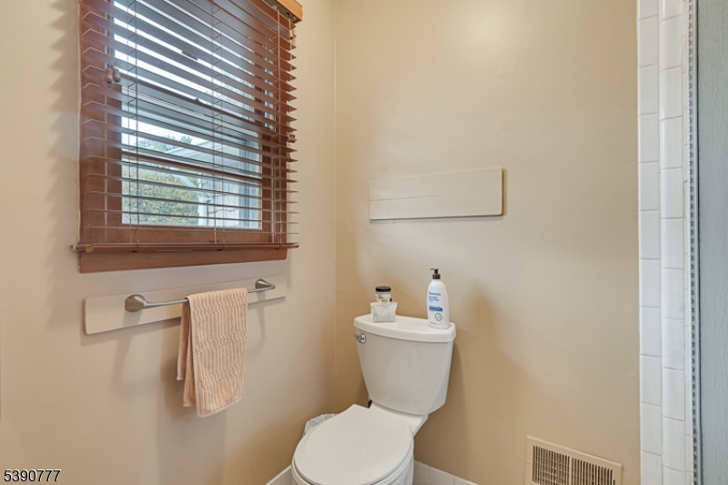 279 Madison Hill Road Clark, NJ 07066 - Photo 15 of 35 a white toilet sitting next to a bathroom sink