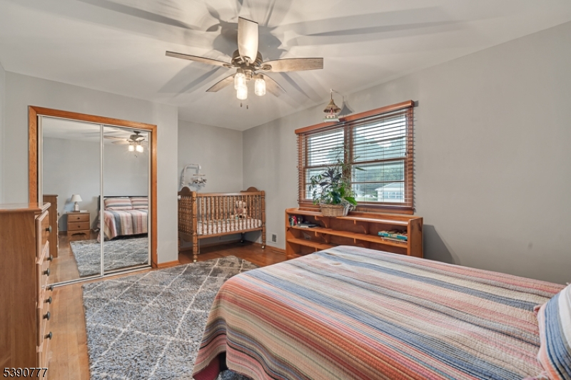 279 Madison Hill Road Clark, NJ 07066 - Photo 18 of 35 a bedroom with a bed and a large mirror
