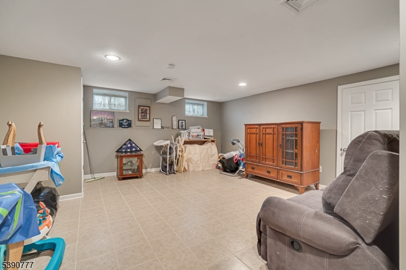 279 Madison Hill Road Clark, NJ 07066 - Photo 22 of 35 a view of a livingroom with furniture and a couch