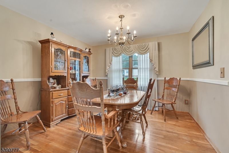 279 Madison Hill Road Clark, NJ 07066 - Photo 6 of 35 a view of a dining room with furniture and chandelier