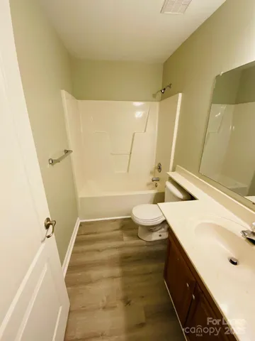 a bathroom with a sink a toilet and tub