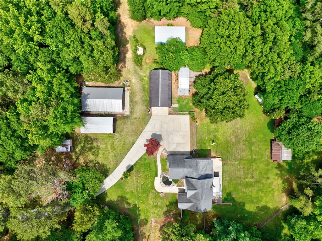1016 Campbell Road Belton, SC 29627 - Photo 37 of 50 An aerial perspective reveals a serene property nestled amidst a lush green landscape with mature trees.