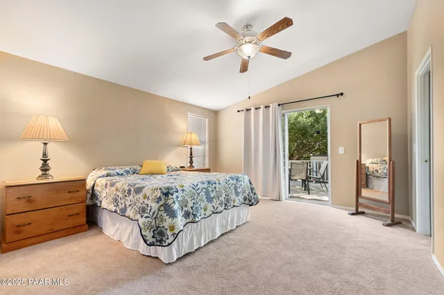 a bedroom with a bed and a lamp