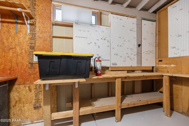a view of a chairs and table in the patio