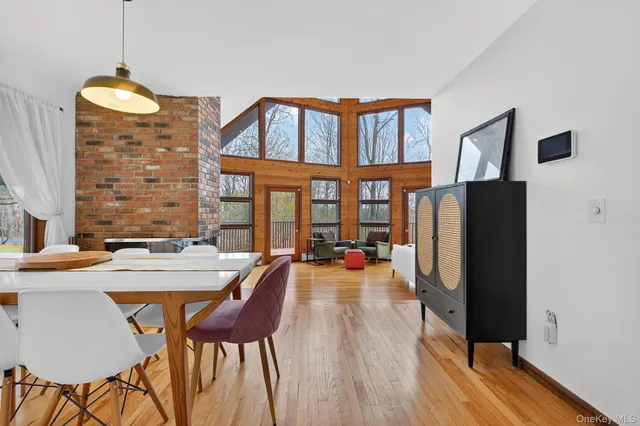 a view of a dining room with furniture and window