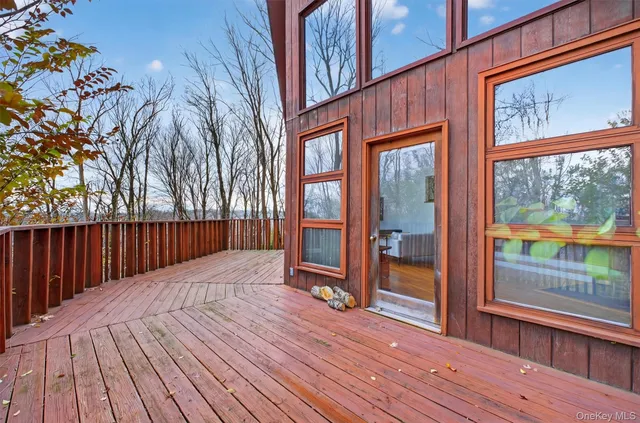 a balcony with wooden floor