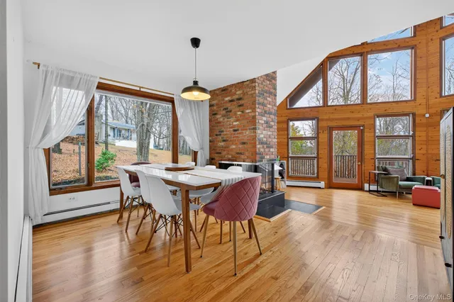 a view of a dining room with furniture window and wooden floor