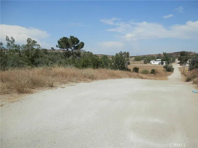 a view of a dry yard with mountain